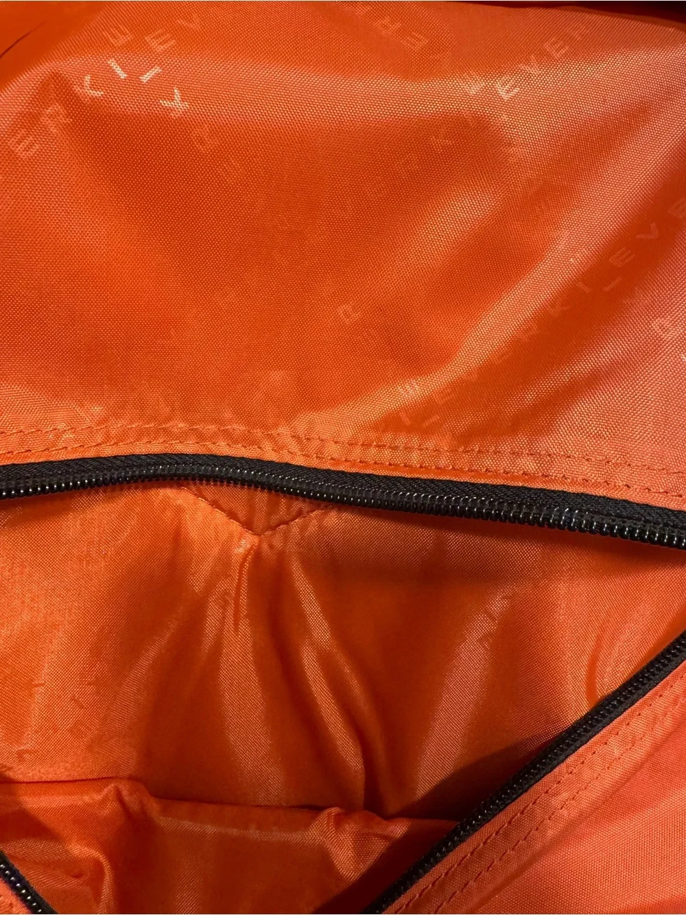 Black Men's Travel Backpack with Orange Accents Everki large laptop bag.